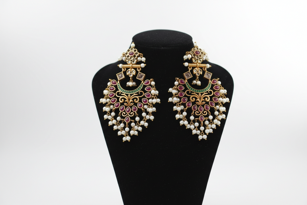 Elegant Indian wedding earrings featuring intricate designs and vibrant colors, perfect for a festive celebration.