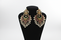 Elegant Indian wedding earrings featuring intricate designs and vibrant colors, perfect for a festive celebration.